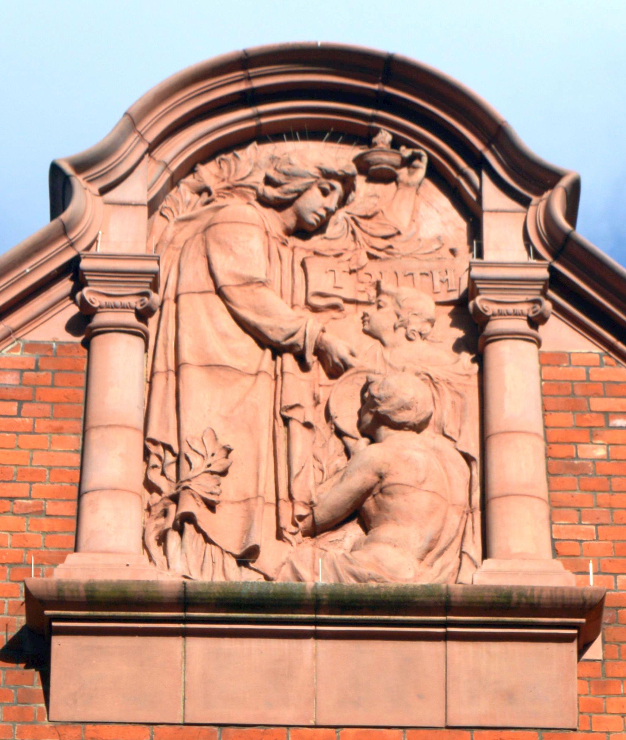 'Truth' holding the lamp of learning